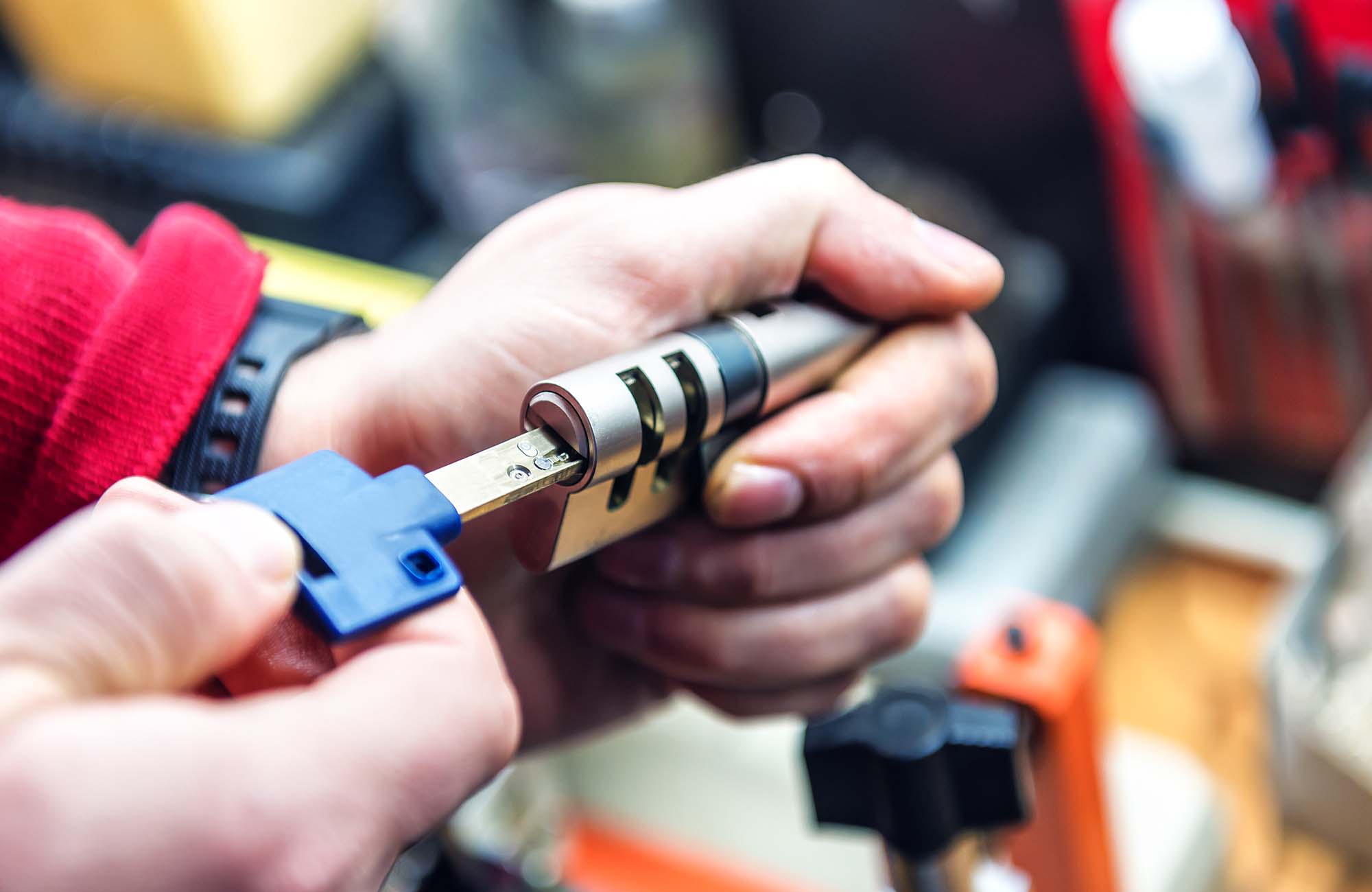 Locksmith is testing door lock cylinder with key in Ashford. Kent