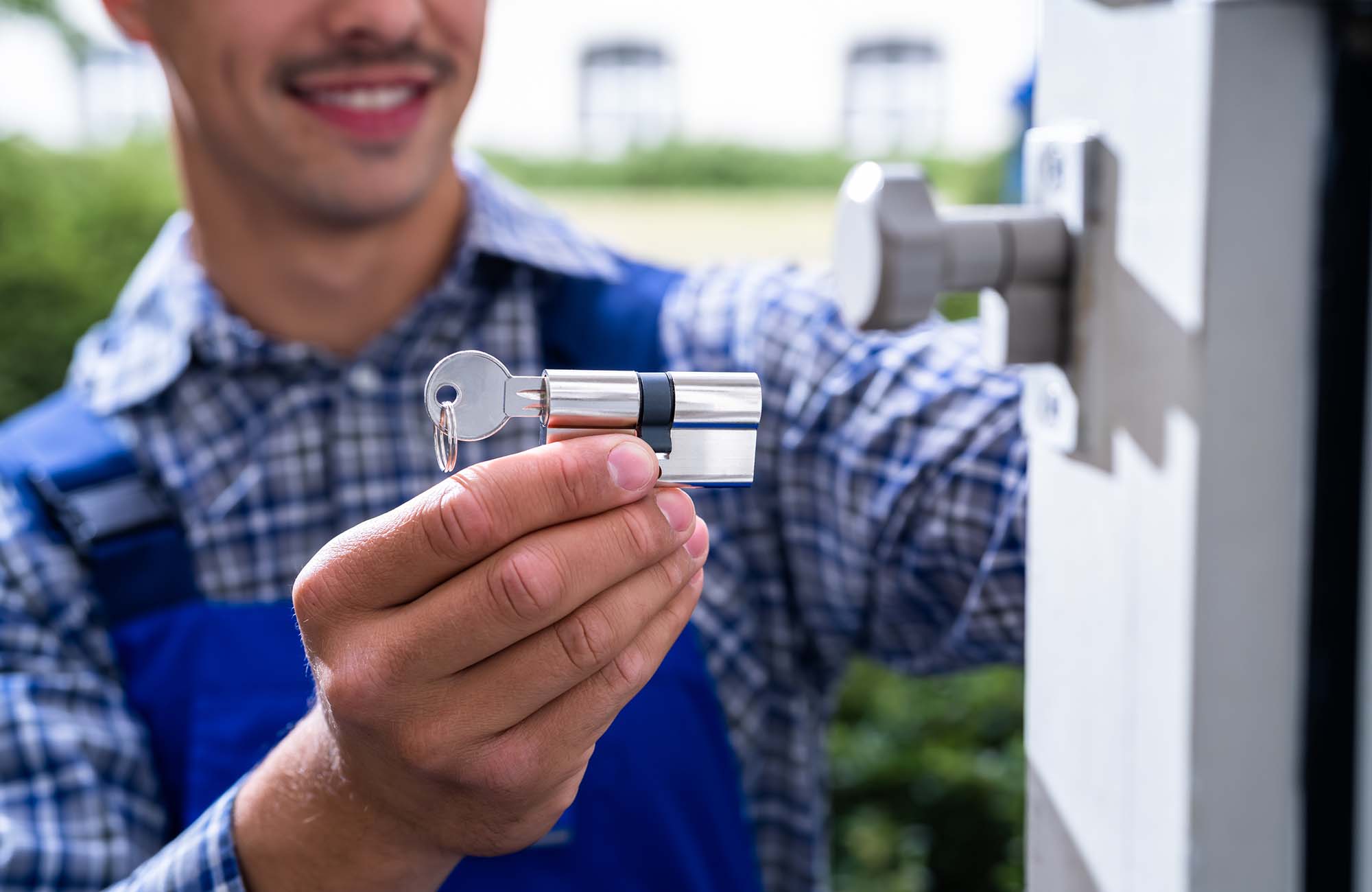 Locksmith Lock Door Repair. Worker Changing And Cylinder in Ashford. Kent