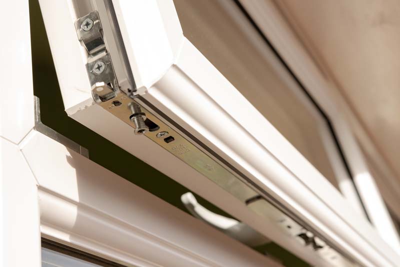 Close-up of a newly installed, high security double glazing window system. Details of the multiple latching system can be seen on this partially opened window in Ashford. Kent